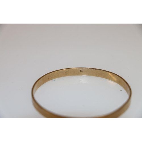 130 - 9ct gold bangle of plain form, 14.9g.