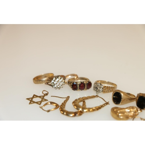 131 - Eight rings, four pairs of earrings, and two charms, all 9ct gold, 24.6g.