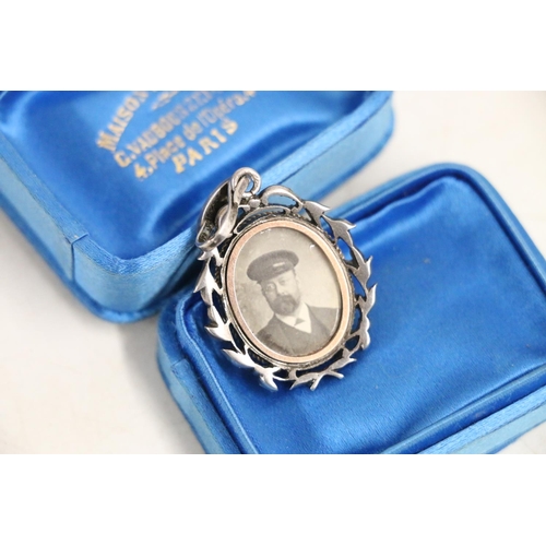 147 - PT Barnum: Silver, blue enamel and paste-set locket containing a photograph of a gentleman, possibly... 