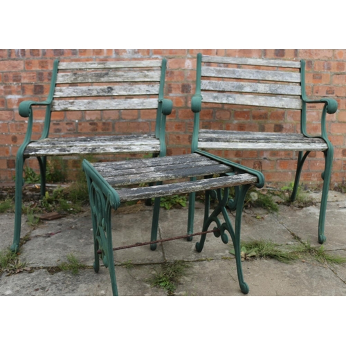 122 - Pair of cast iron and wood garden seats and a matching table, chairs measure 80cm high.