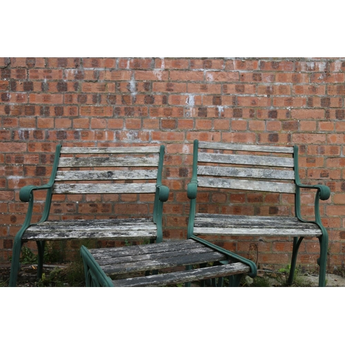 122 - Pair of cast iron and wood garden seats and a matching table, chairs measure 80cm high.