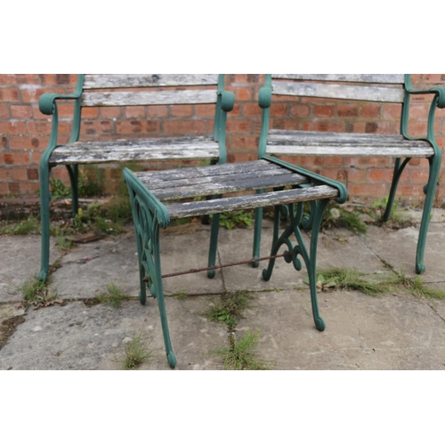 122 - Pair of cast iron and wood garden seats and a matching table, chairs measure 80cm high.