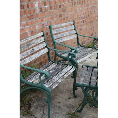 122 - Pair of cast iron and wood garden seats and a matching table, chairs measure 80cm high.