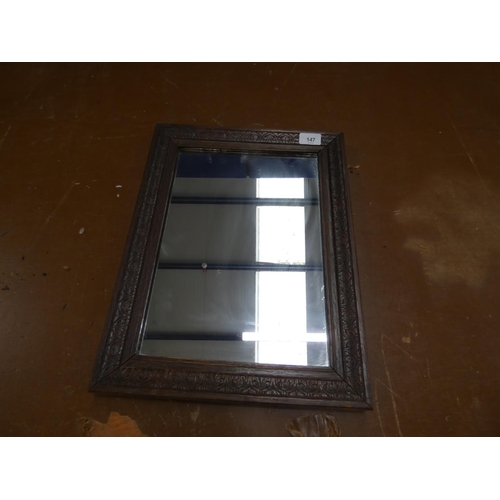 147 - Carved oak small wall mirror.