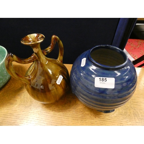 185 - Arts and crafts style twin handled vase and blue art deco style vase.