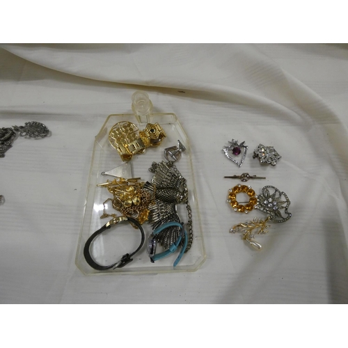 203 - Large box of costume jewellery to include watches, brooches etc.