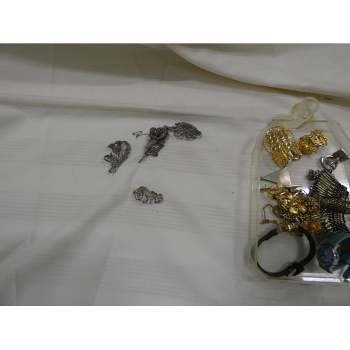 203 - Large box of costume jewellery to include watches, brooches etc.