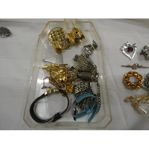 203 - Large box of costume jewellery to include watches, brooches etc.