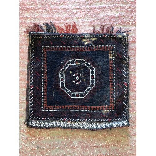 818 - Hand woven bag face, with areas of wear, along with another mat.