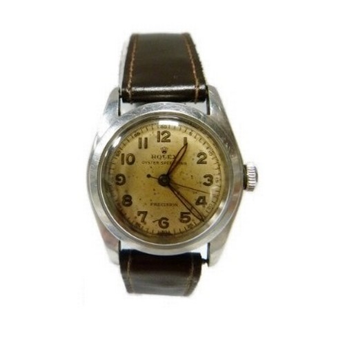Rolex: Oyster Speedking precision wristwatch circa 1947, stainless bubbleback case with signed champagne dial with Arabic numerals, stamped Rolex Oyster to the crown, case diameter approximately 30mm, on replacement leather strap.