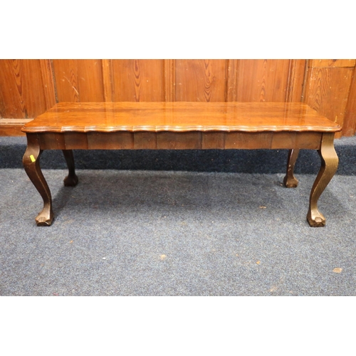 768 - Mahogany coffee table having pie crust edge, raised on cabriole supports terminating in ball and cla... 