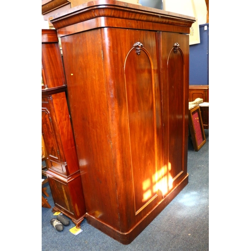 773 - Victorian mahogany two door wardrobe, with two interior base drawers, raised on plinth base, 207cm h... 