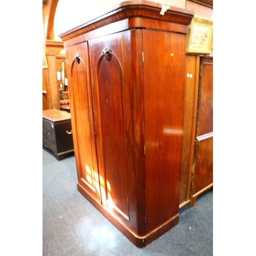 773 - Victorian mahogany two door wardrobe, with two interior base drawers, raised on plinth base, 207cm h... 