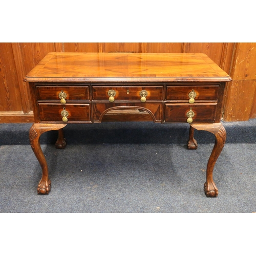 797 - 20th century walnut kneehole desk, with five frieze drawers, brass handles, raised on shell carved c... 