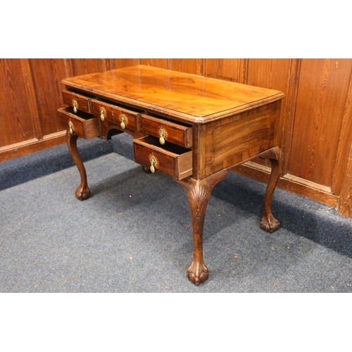 797 - 20th century walnut kneehole desk, with five frieze drawers, brass handles, raised on shell carved c... 