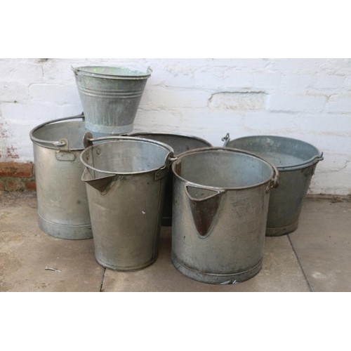 37 - Two galvanized milk pails with pouring spouts, and four others.