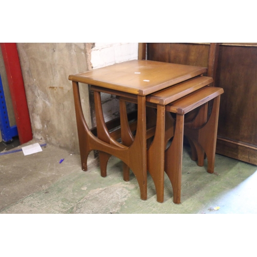 829 - Set of three teak nesting tables, largest with label Stateroom by Stonehill, 48cm.