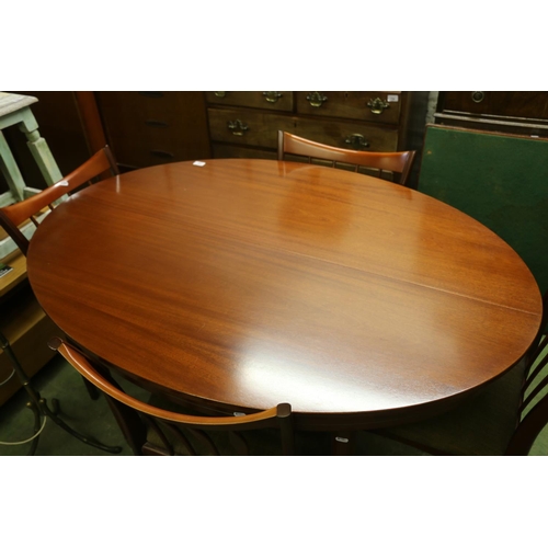 758 - Grieves and Thomas oval topped dining table with internal leaf and four chairs.