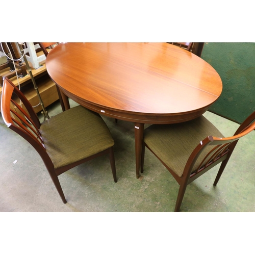 758 - Grieves and Thomas oval topped dining table with internal leaf and four chairs.