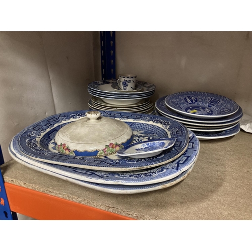 235 - Blue and white china to include platters, plates, etc.