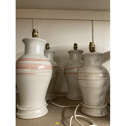 278 - Four baluster pottery table lamps, 42cm.