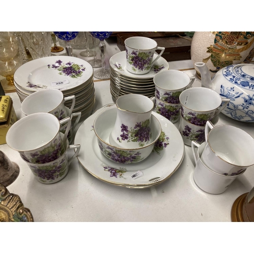 296 - Tea set with purple flowers and marked H H & G to base.