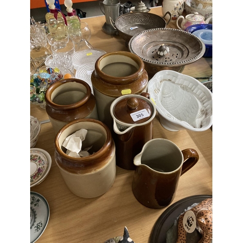 305 - Three stoneware jars, two jugs and armadillo jelly mould.