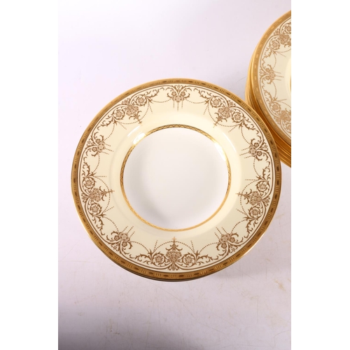 1 - Twelve early 20th century Minton rim soup plates, with foliate gilt decoration, retailed by Davis, C... 