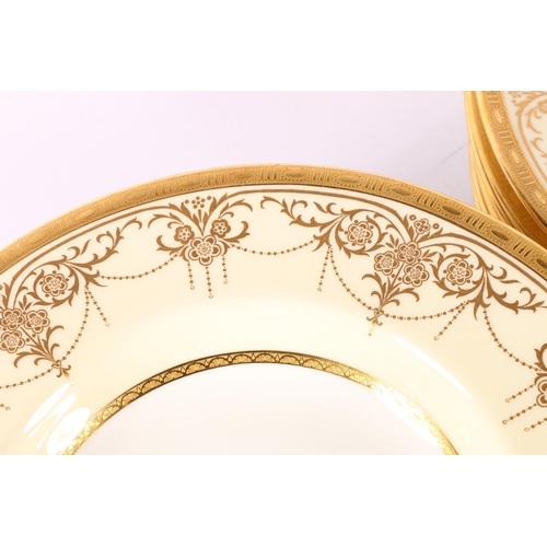 1 - Twelve early 20th century Minton rim soup plates, with foliate gilt decoration, retailed by Davis, C... 