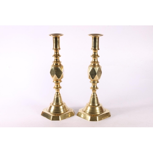 48 - Pair of Diamond brass candlesticks, 27.5cm.