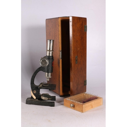 51 - Oak tambour mantle clock, dial inscribed Henderson's, 23cm, and a microscope in original box. 