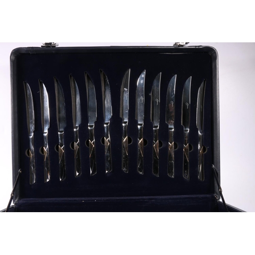 54 - Suissine cutlery in traveling case style canteen.