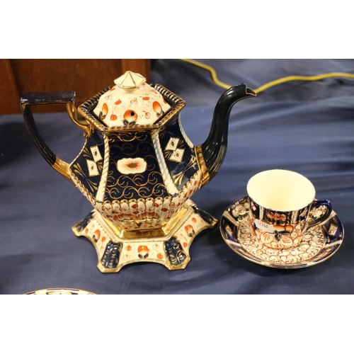 57 - Imari palette ceramics to include a Royal Crown Derby vase, jugs, plates, etc.