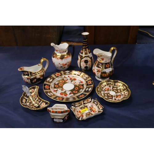 57 - Imari palette ceramics to include a Royal Crown Derby vase, jugs, plates, etc.