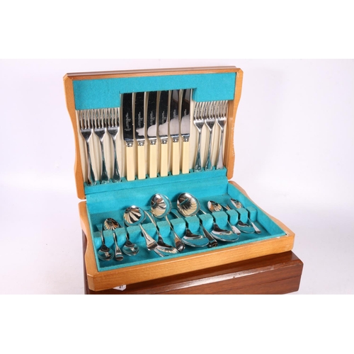 59 - Cutlery canteen with set of twelve fish knives and forks having mother of pearl handles, and another... 