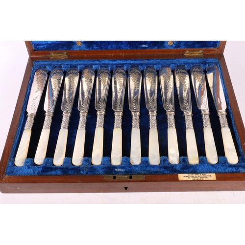 59 - Cutlery canteen with set of twelve fish knives and forks having mother of pearl handles, and another... 