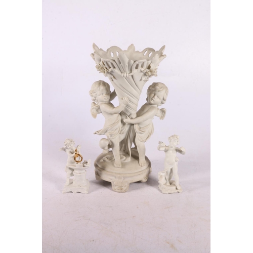 70 - Biscuit pottery vase supported by two cherubs, 22cm, and two small cherubs.