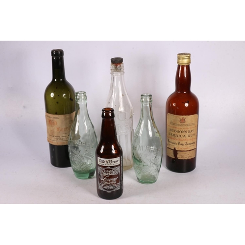 74 - Two late 19th early 20th century Schweppes bottles with royal appointments, 22cm, and a Hays bottle,... 