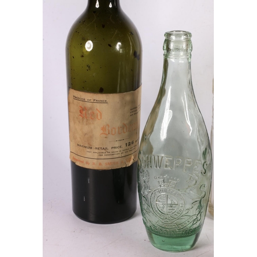 74 - Two late 19th early 20th century Schweppes bottles with royal appointments, 22cm, and a Hays bottle,... 