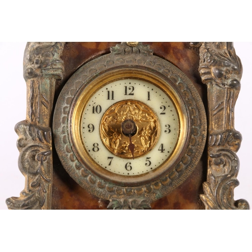 104 - Table clock stamped to back manufactured by British United Clock Co. Ltd. Birmingham, 14cm.