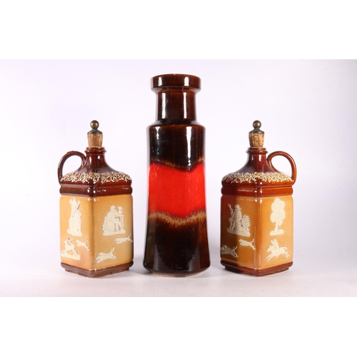 105 - West German lava vase, 32cm, and two Doulton Lambeth stoneware square section bottles decorated with... 