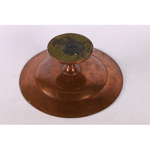 94 - Late 19th early 20th century copper tazza with foliate and cherub decoration to edge, 7 x 20cm.