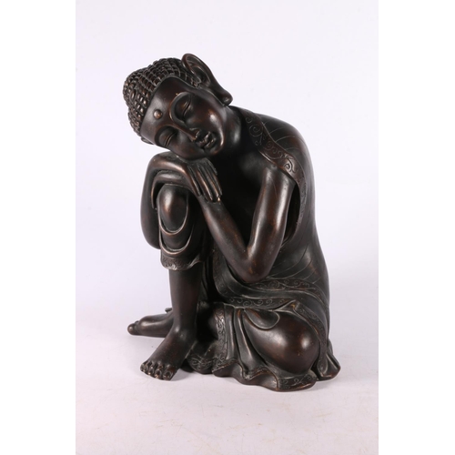 98 - Resin figure of a Southeast Asian deity sleeping, 29cm.