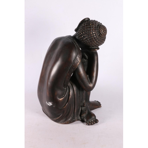 98 - Resin figure of a Southeast Asian deity sleeping, 29cm.