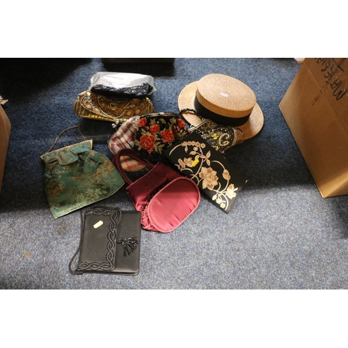 353 - Two boxes containing vintage material, handbags, and a Panama straw hat.