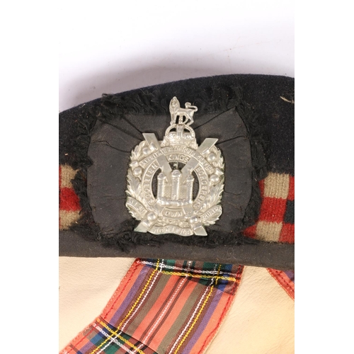 375 - Glengarry beret with KOSB cap badge, a tartan bonnet, a Masonic Apron 'The Gael 609', a Gordon Highl... 