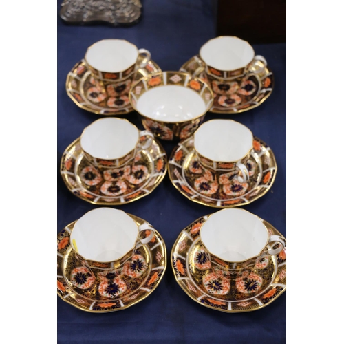 117 - Six Royal Crown Derby Imari cups and saucers, with sugar bowl.