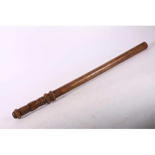 124 - Oak police baton with ribbed handle, 60cm.