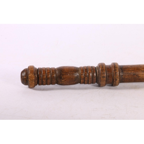 124 - Oak police baton with ribbed handle, 60cm.