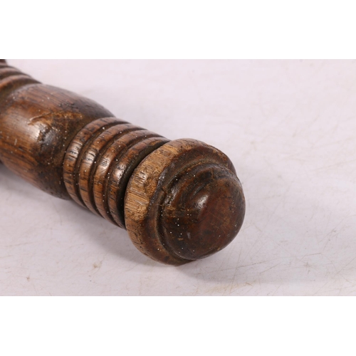 124 - Oak police baton with ribbed handle, 60cm.